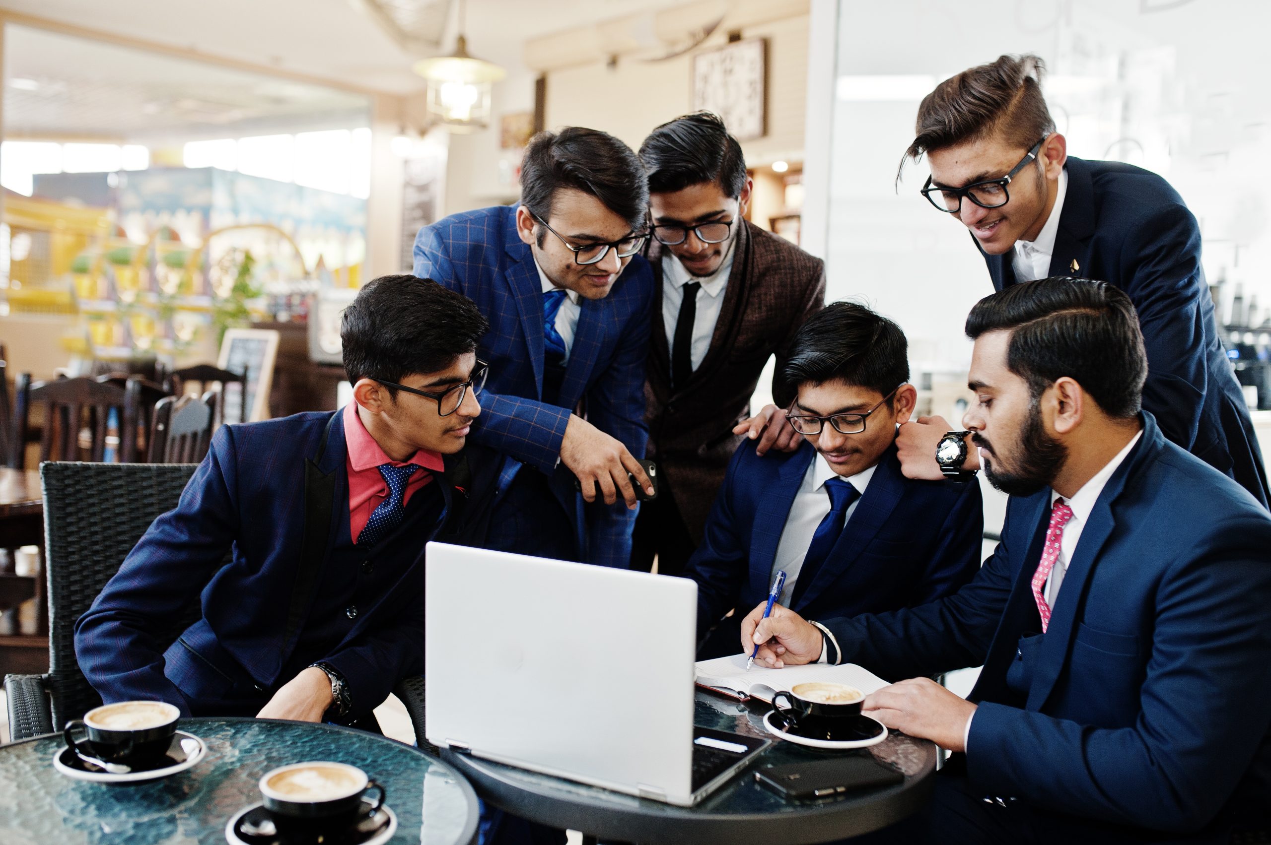 Collaborative process of indian business mans during brainstormi About us